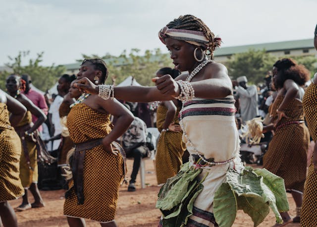 Women engaged in traditional cultural practices and storytelling.